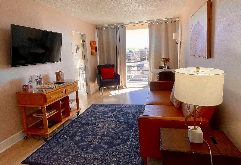 Lots of natural light and a balcony with views of the Sierra Mountains and Midtown.