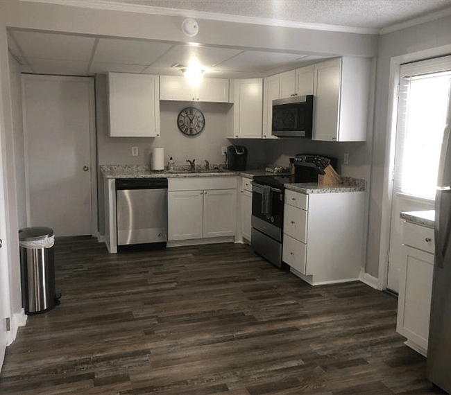 Fully equipped kitchen with all essential implements such as dish washer, stove & spacious fridge