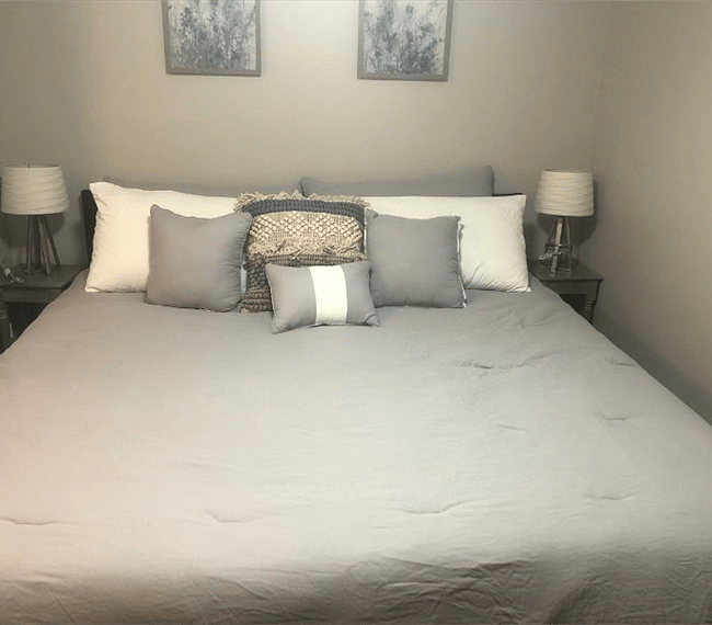 Masters bedroom with king sized bed, drawers, wardrobe, mirror & lovely night stands