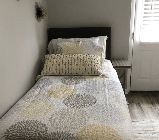 2nd bedroom with comfy twin beds, carpet, drawer & nighstands
