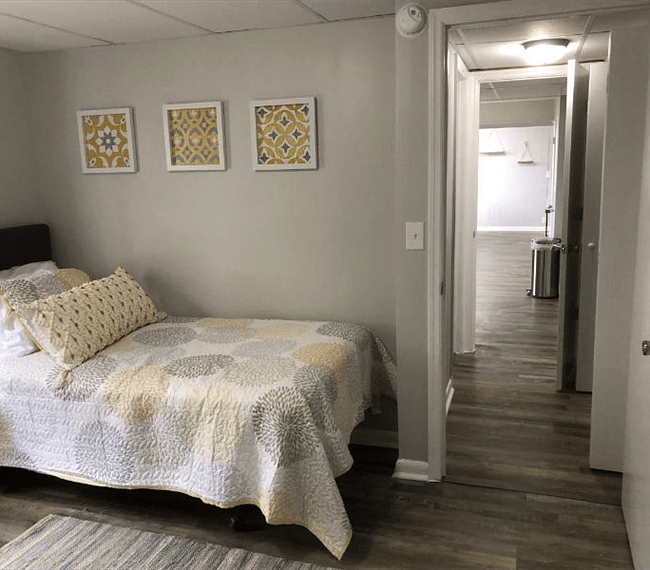 2nd bedroom with comfy twin beds, carpet, drawer, wardrobe & nighstands