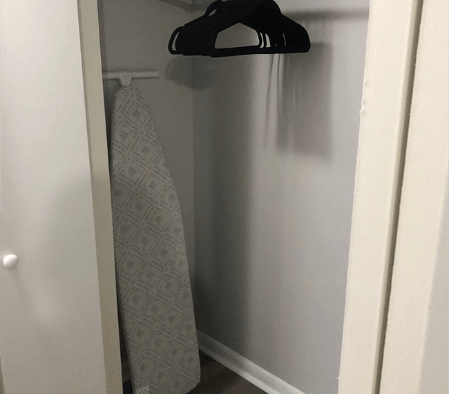 Youll find the ironing table in the wardrobe