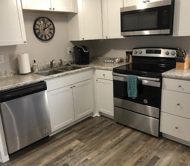 Fully equipped kitchen with all essential implements such as dish washer, stove & spacious fridge