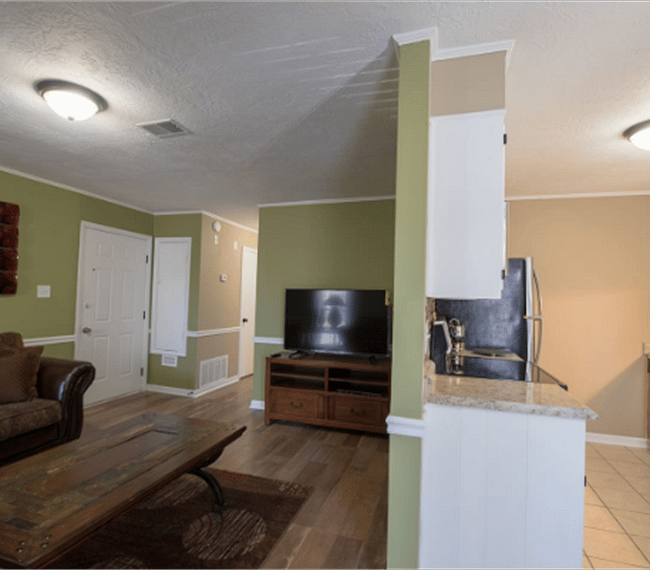 2nd living room with 2 lawson style sofa & plane table, right next to the living room youll find the kitchen