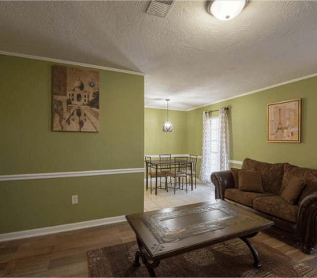 2nd living room with 2 lawson style sofa & plane table, right next to the living room youll find the dining area