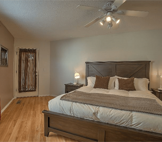 2nd masters bedroom with king sized platform bed, drawers, TV, wide wardrobe & personal bathroom