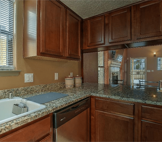Fully equipped kitchen with all esential implements such as microwave, stove & coffee maker