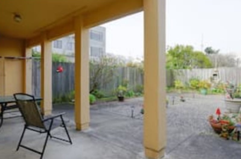 Spacious patio with sitting area and griller