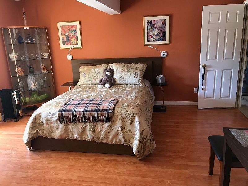 Cozy and bright bedroom with queen sized bed, work station, aditional sitting area, TV & amazing view