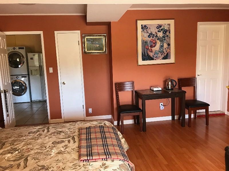 Cozy and bright bedroom with queen sized bed, work station, aditional sitting area, TV & amazing view