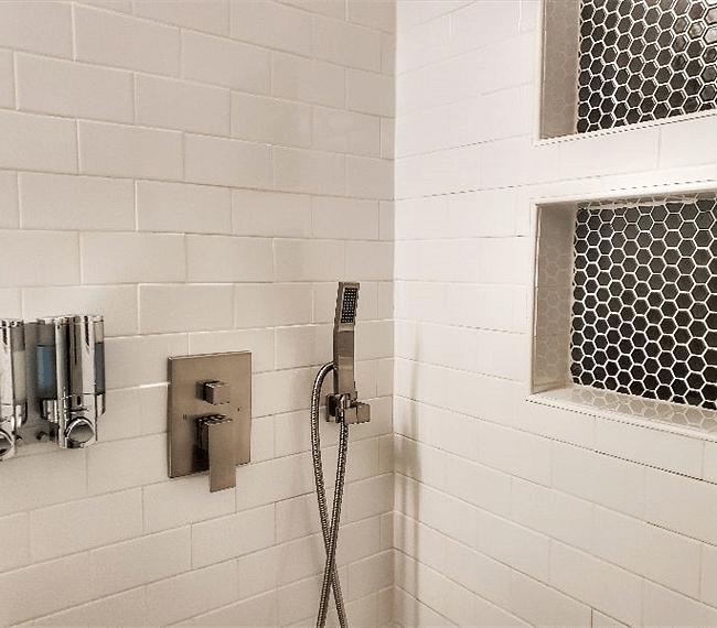 Spacious 12" rain shower head for a relaxing and luxurious experience and handheld shower head. Shampoo and body wash provided.