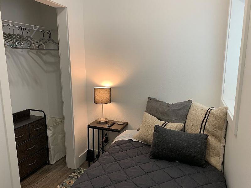 Full size closet with small dresser