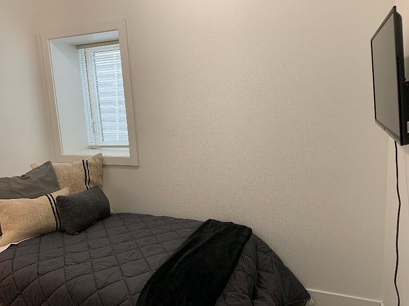 Second bedroom with twin bed, premium memory foam mattress. Large egress window for lots of natural light.