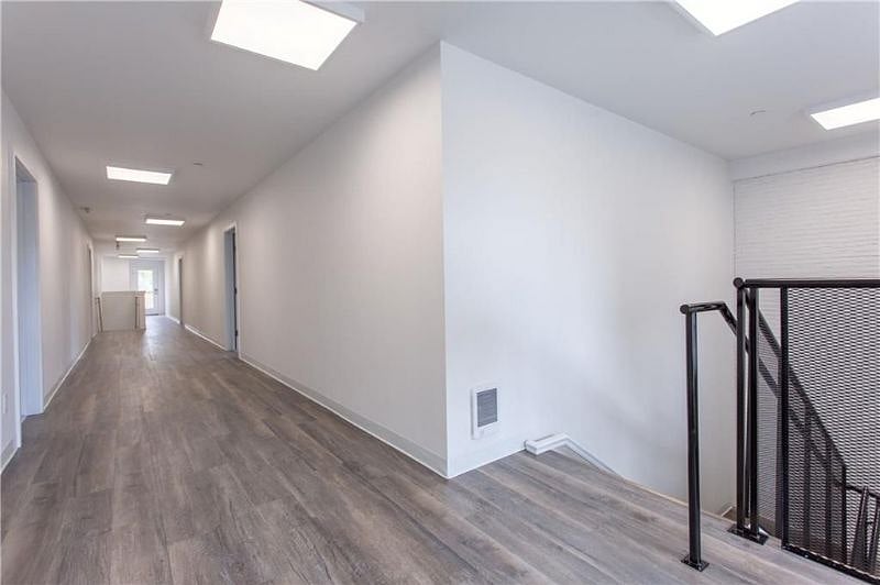 Interior upper hallway. Unit 5 is downstairs and entry from the rear parking area is at ground level so no stairs to access unit.