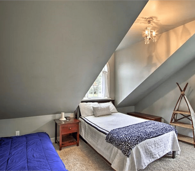 The second bedroom has a queen-sized bed.