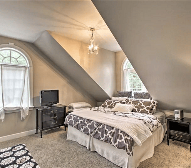 The master bedroom boasts a king-sized bed.