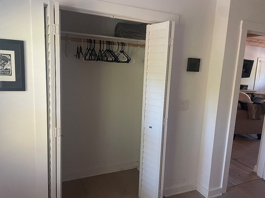 Large clothes closet in bedroom.