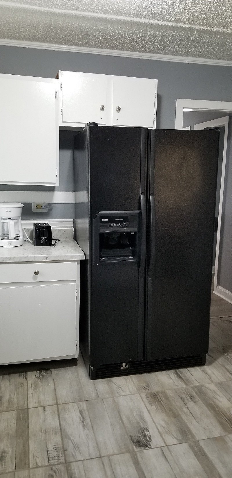 Kitchen - Features pots & pans, dishes & flatware, coffee maker & toaster. Full size refrigerator and an electric stove.