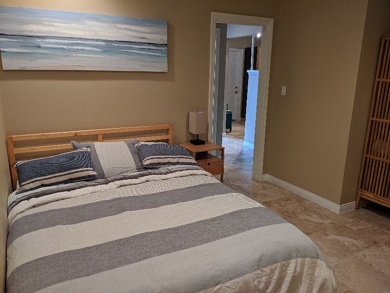 Queen Bed in Middle (2nd room).  Can use hallway bathroom with shower or share master bath through access door. Door to hallway.  