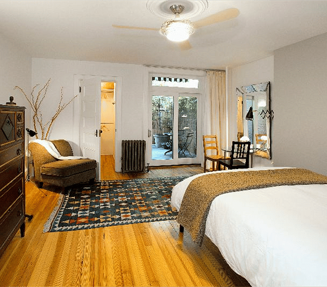Large bedroom with view of private terrace.