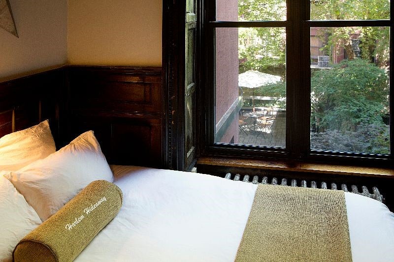 Bed with view of backyard.
