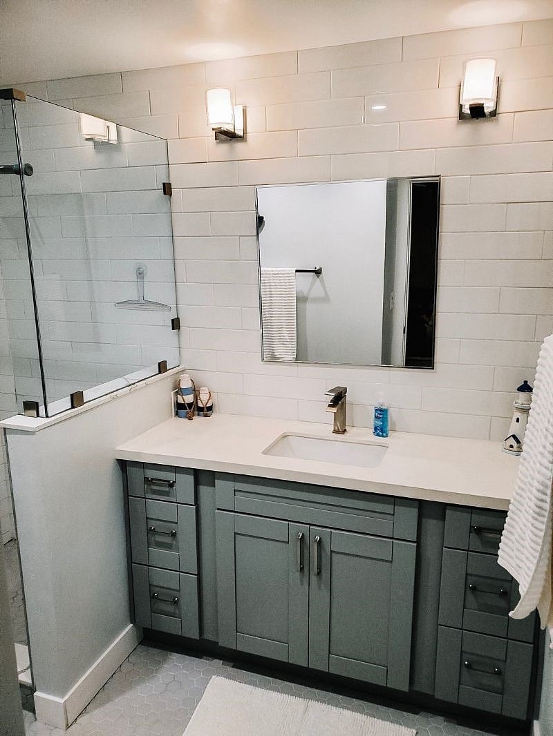 Full bathroom with walk-in shower and vanity sink