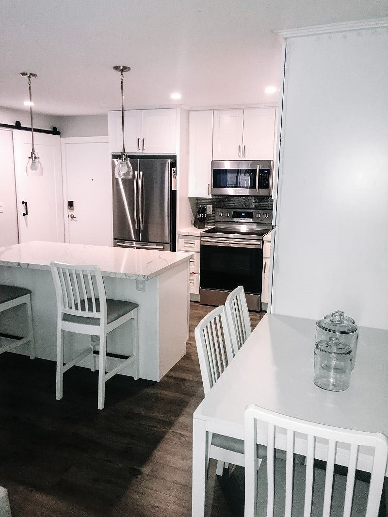 Dining area adjoining to the kitchen fully stocked with stainless steal appliances, and eat-in island.