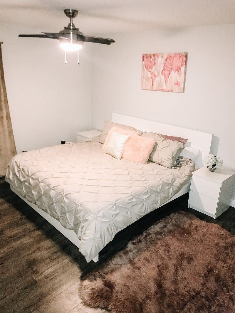 The Masters bedroom has a king sized bed, wide drawers and an attached full bathroom