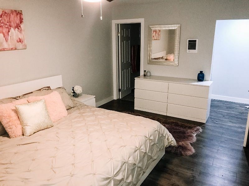Spacious master bedroom with ample dresser, mirror and very spacious