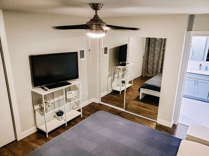 2nd bedroom with queen sized bed, plasma TV and attached full bathroom
