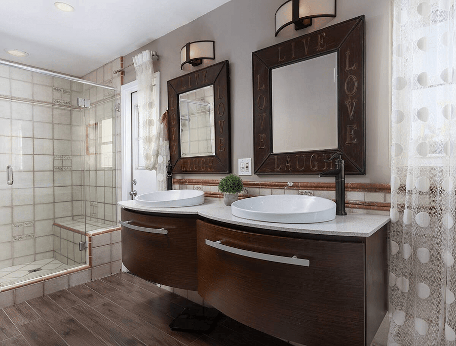 Double sinks, shower, and door accessing the backyard - also serves as the private entrance to the space.