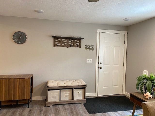 Front door offers a place to hang your coat and take off your shoes.  The table to the left opens to seat 6 people.