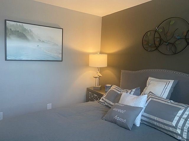 Smaller bedroom's art work includes this Surfer at Dawn