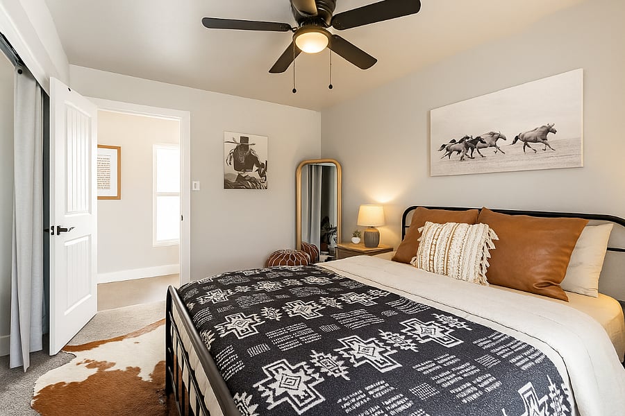 Spacious, serene, and beautifully styledthis queen bedroom blends comfort and charm with a modern Western flair.