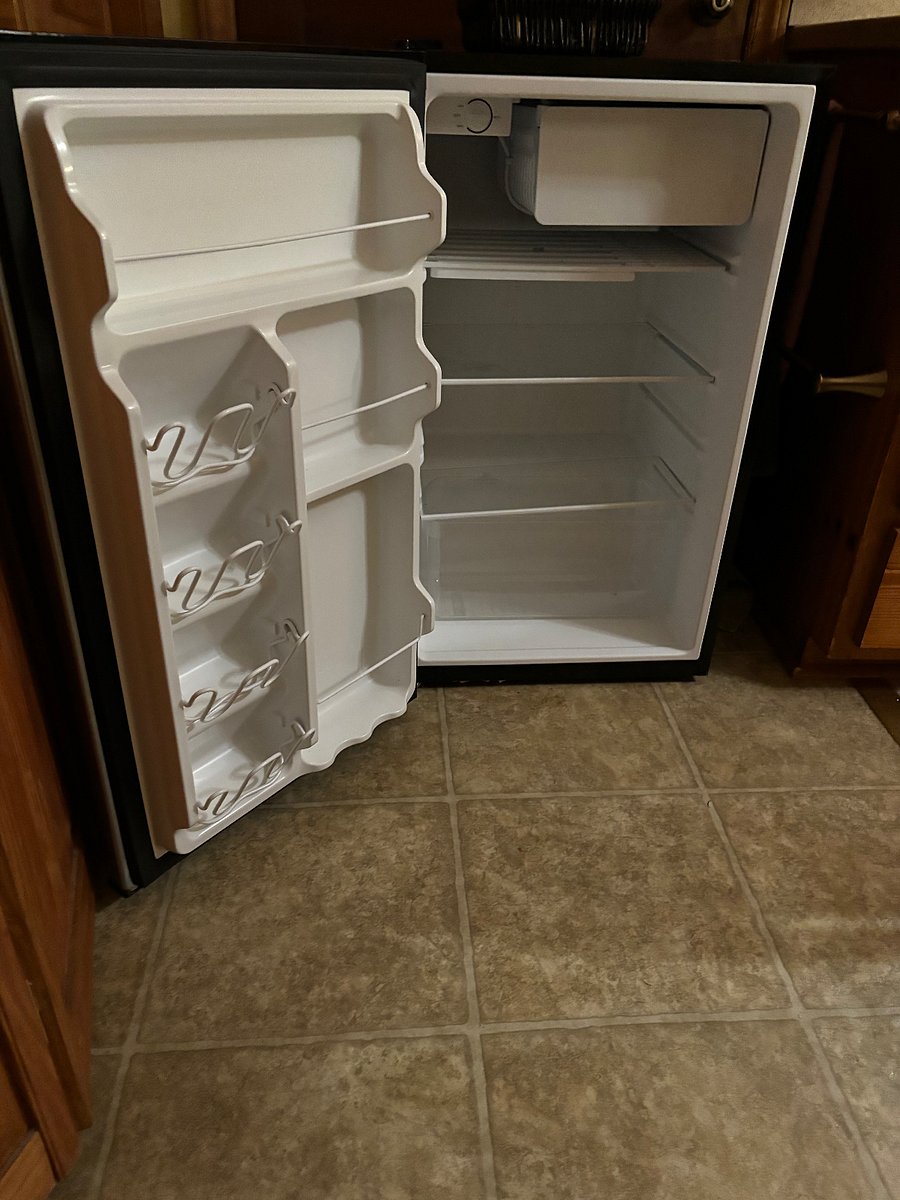 Small refrigerator dedicated just to renter. Renter's freezer items are kept in a side by side frig/freezer