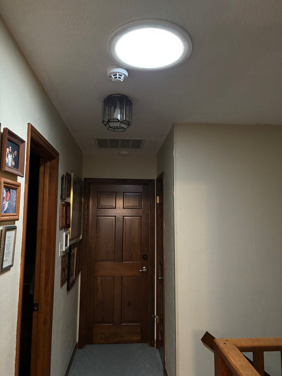 Room at other end of hall that is locked. The light above is a skylight/ nightlight. 