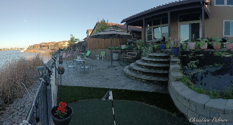 Full access to back yard with Lake View! Two putting greens!