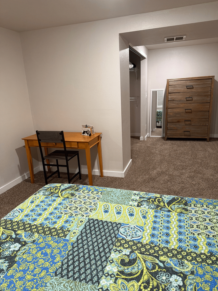 Dedicated workspace, over-size dresser, floor mirror, and open closet provide everything needed for a comfortable extended stay