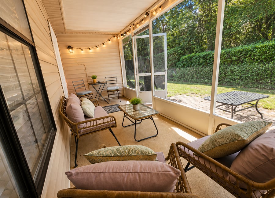 Screened in Patio with fenced backyard