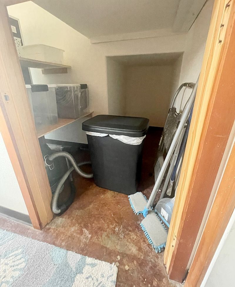Storage space behind the fridge and under stairs to upper unit. Great storage for bike, blow up SUP, etc.
