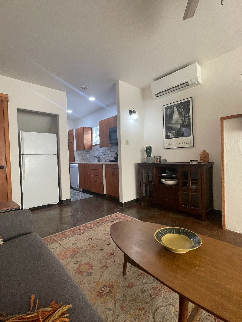 View of kitchen as you're sitting on the comfy couch.
