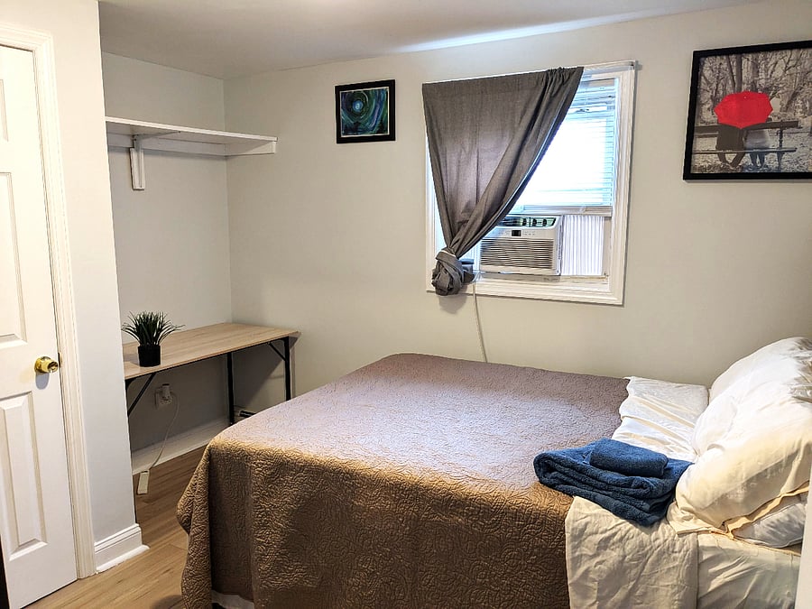 Updated flooring and painted walls in bedroom