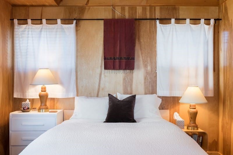 Queen sized bed, room darkening shades in addition to the curtains.