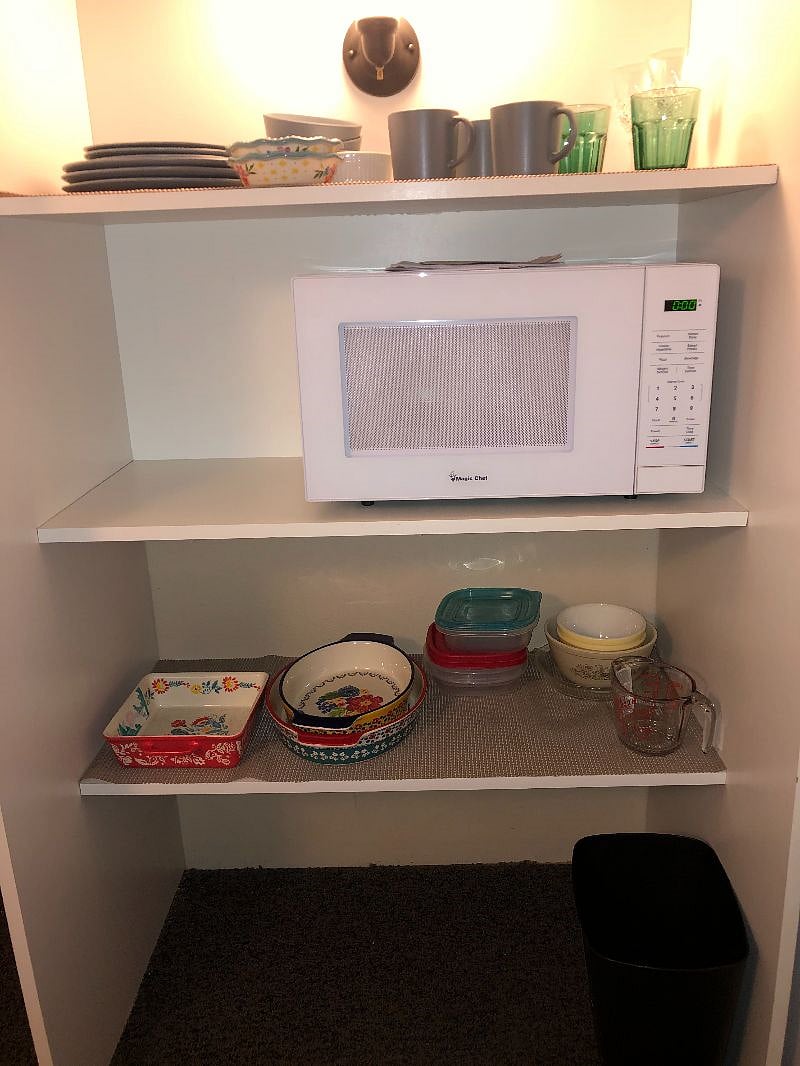Microwave large enough for mug or plate. Extra storage area