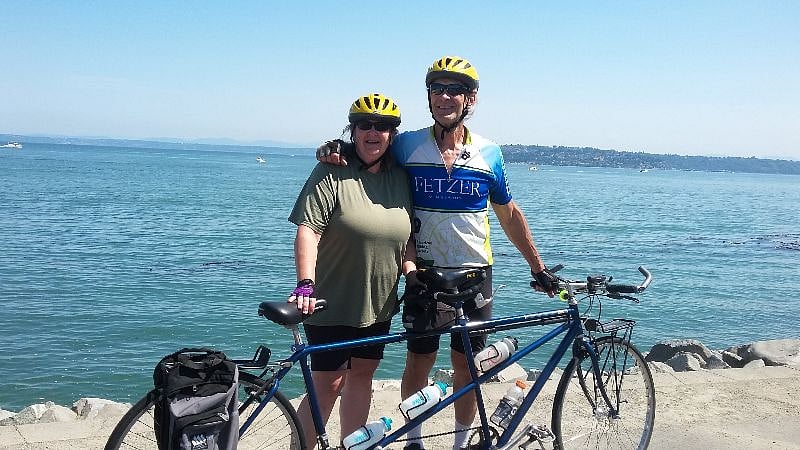 This is us by the waterfront. We love to ride our tandem.