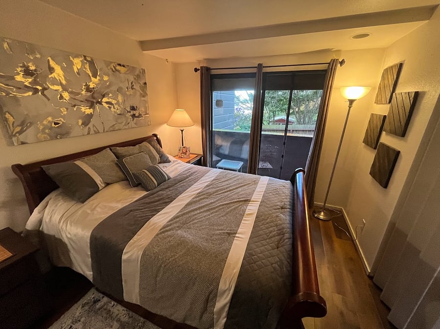 Sliding glass doors lead to a balcony