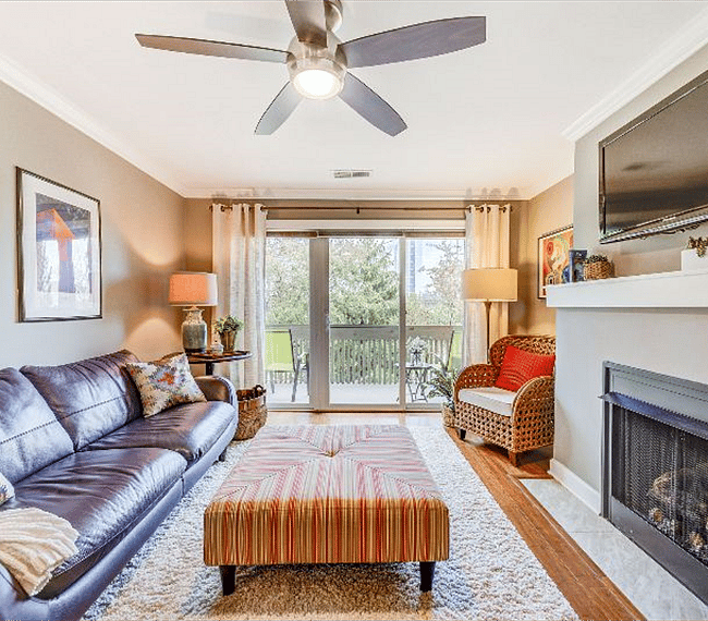another view of the living room looking out to the private deck