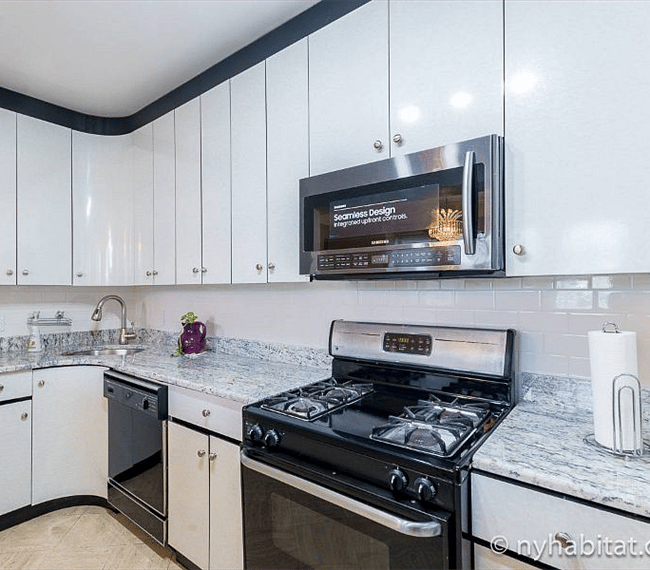Fully stocked kitchen with microwave and oven
