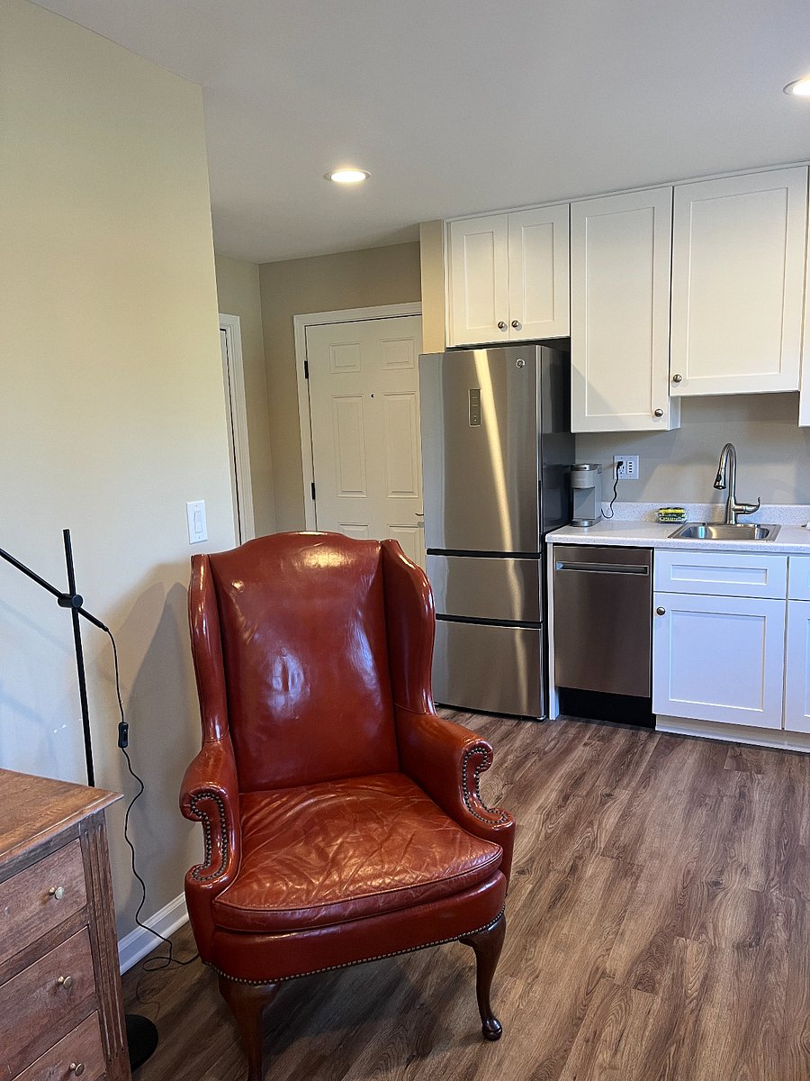 Entrance door rear of chair.