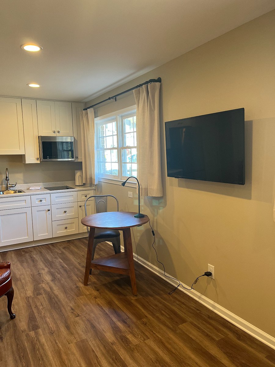 Kitchen, wall mounted TV, extendable arm rotates towards kitchen and towards bedroom.